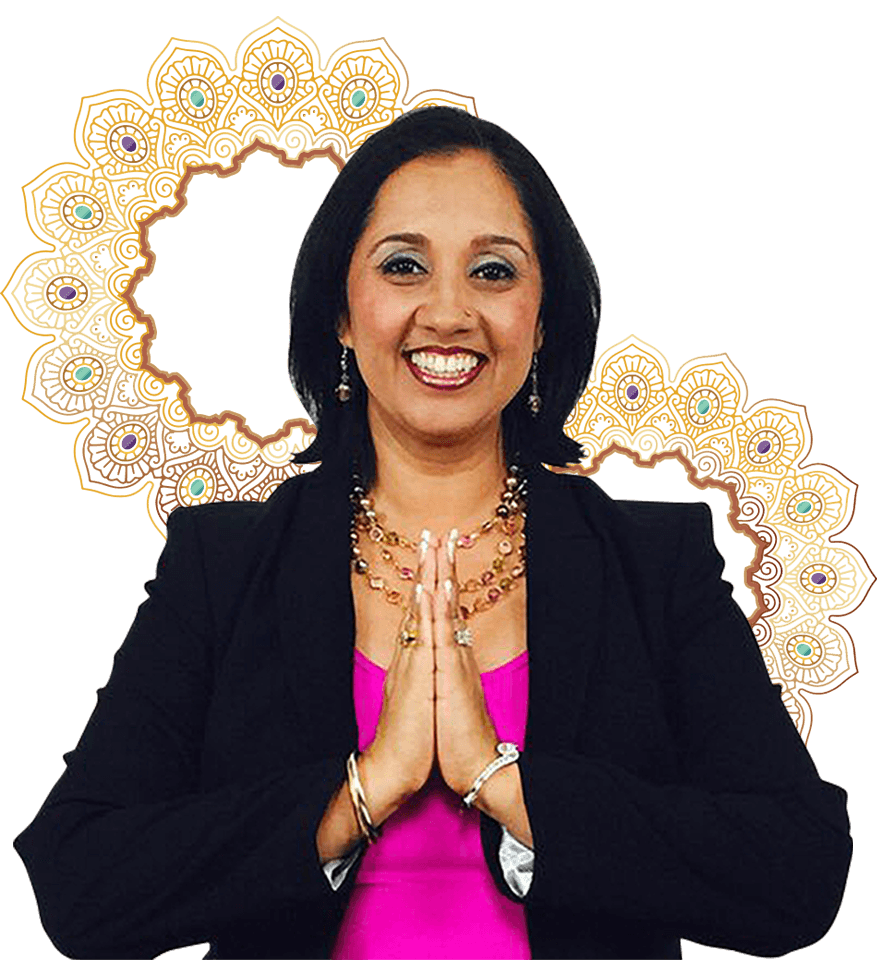 A woman wearing a pink blouse and a gold ring around her neck, who is also an abundance manifestation expert.