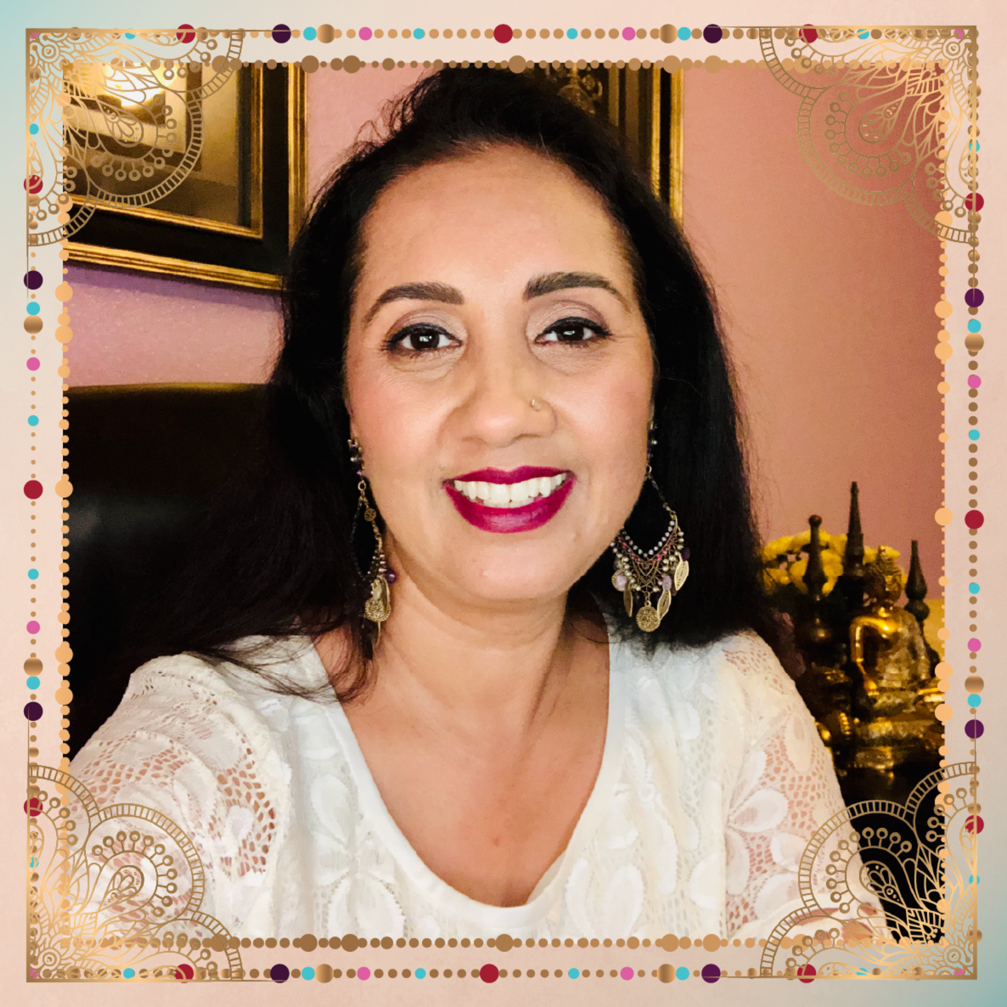 An Indian woman smiling in front of a frame at a bootcamp.